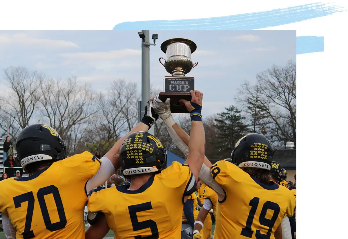 Football team holding up trophy